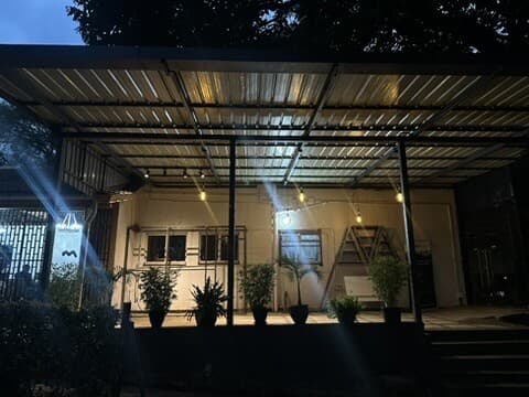 The Yard at night, string lights glowing